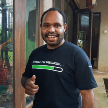 Indonesian trustbuilding is inspired by game creation Indonesian male smiles at the camera and gives a thumbs up